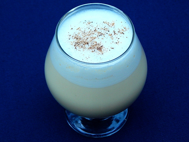 Choose a simple shaken eggnog for a cozy evening in or tom and jerry batter to mix once and pour often. Get cocktail recipes at TwiceasTasty.com.