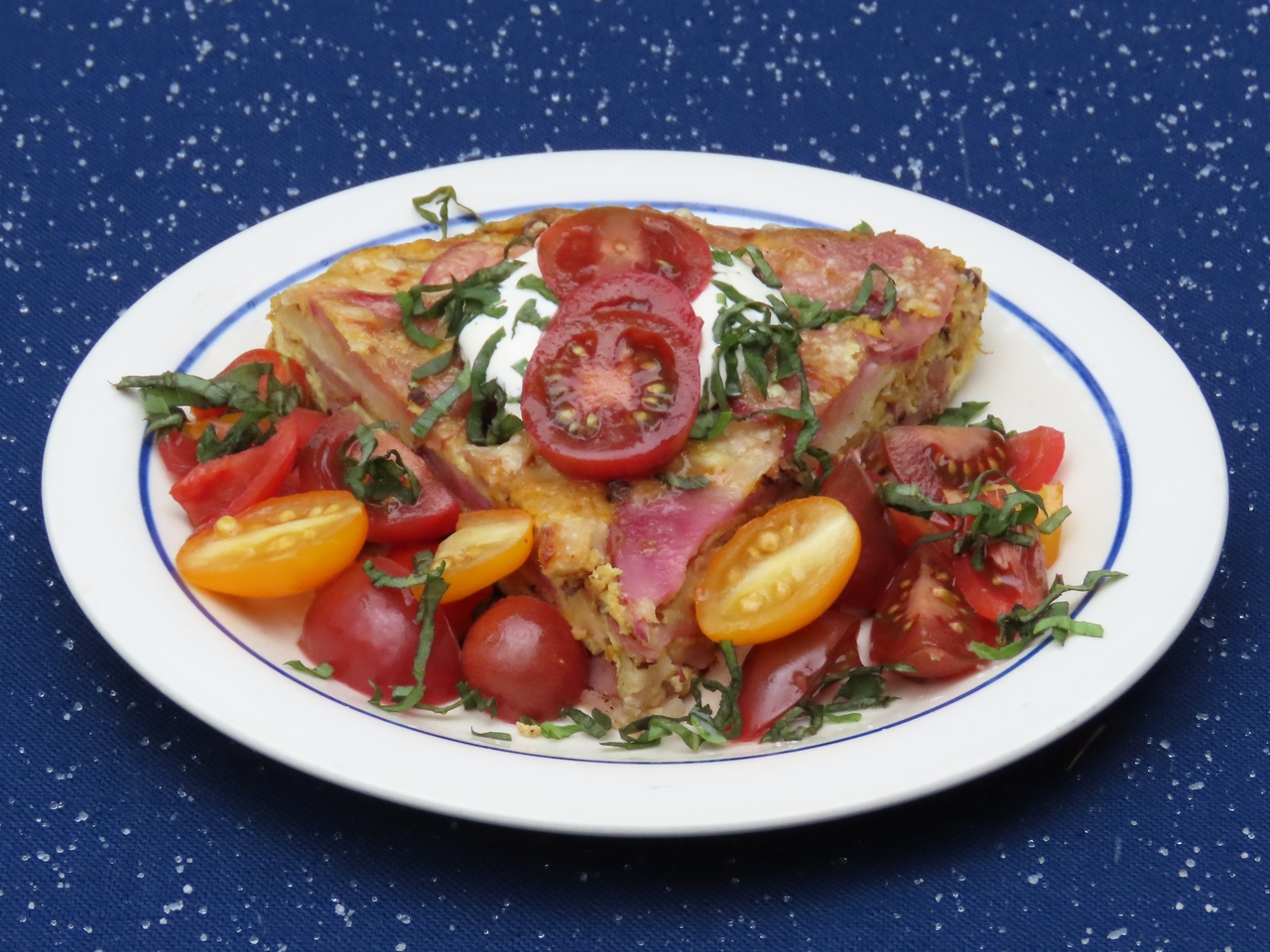 Golden Onion and Potato Frittata with Tomatoes. Get the recipe at TwiceasTasty.com.